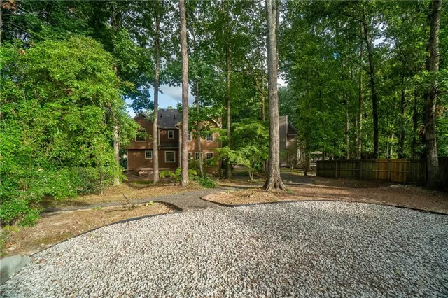 a backyard of a house with trampoline