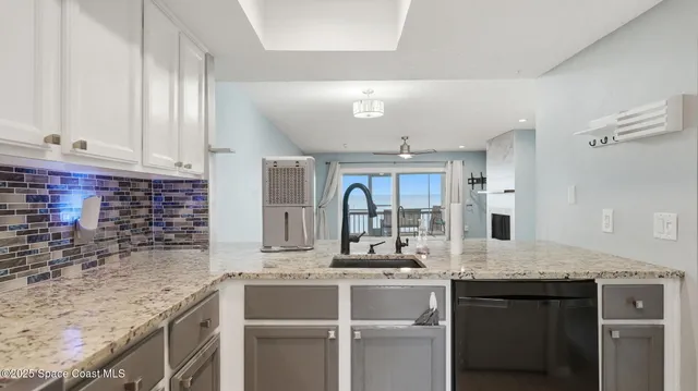 a kitchen with a stove and a refrigerator