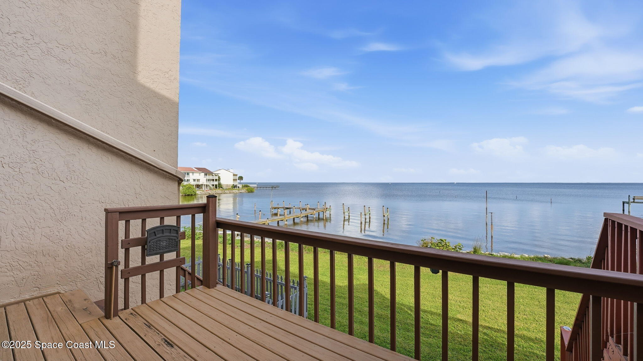 5087 Riveredge Drive, Unit 2 Titusville, FL 32780 - Photo 26 of 62 a view of a balcony with wooden floor