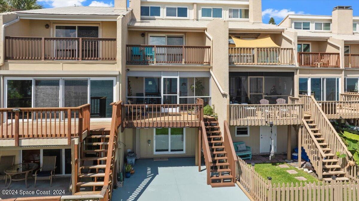 5087 Riveredge Drive, Unit 2 Titusville, FL 32780 - Photo 30 of 62 a front view of a multi story building