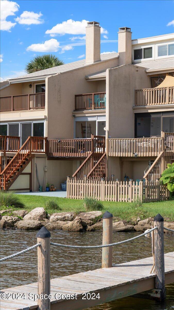 5087 Riveredge Drive, Unit 2 Titusville, FL 32780 - Photo 33 of 62 front view of a house with a yard