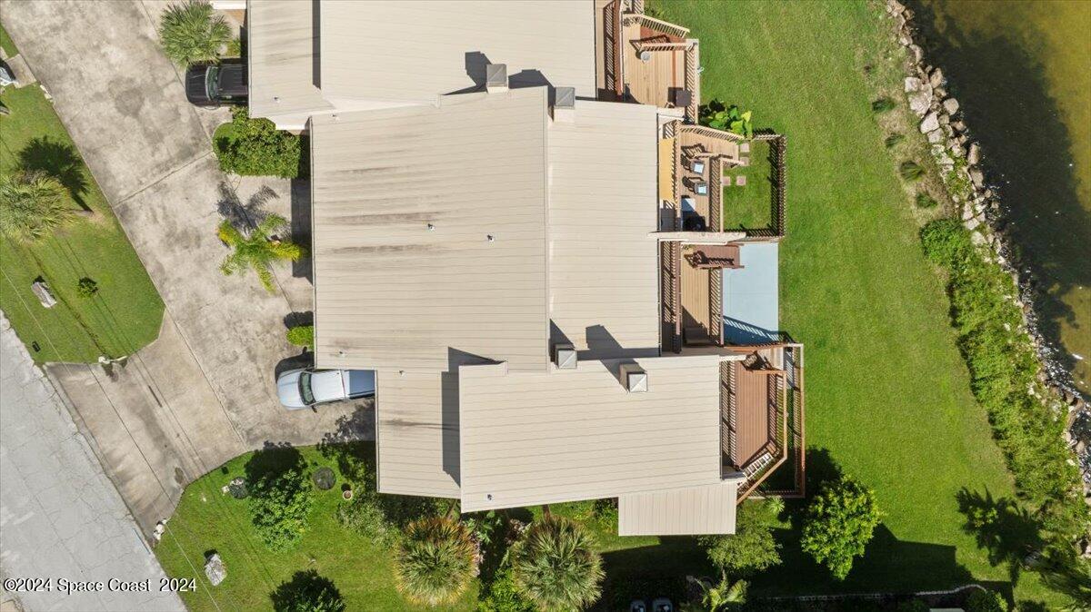 5087 Riveredge Drive, Unit 2 Titusville, FL 32780 - Photo 36 of 62 an aerial view of a house with a yard