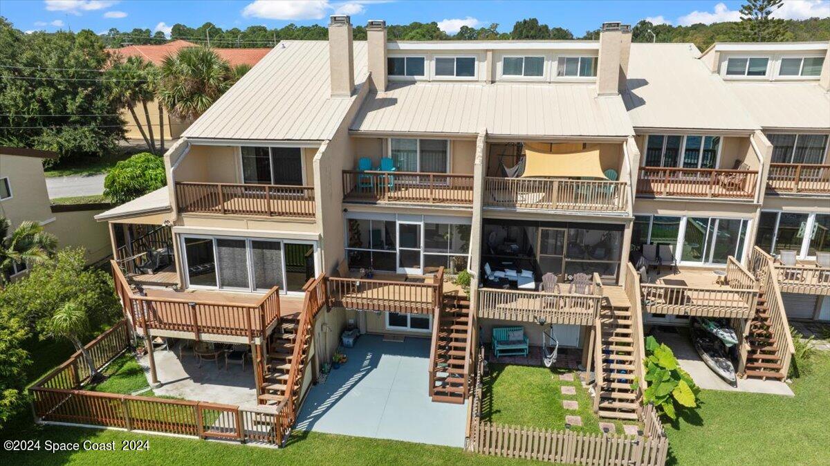 5087 Riveredge Drive, Unit 2 Titusville, FL 32780 - Photo 37 of 62 a aerial view of a house with swimming pool and sitting area