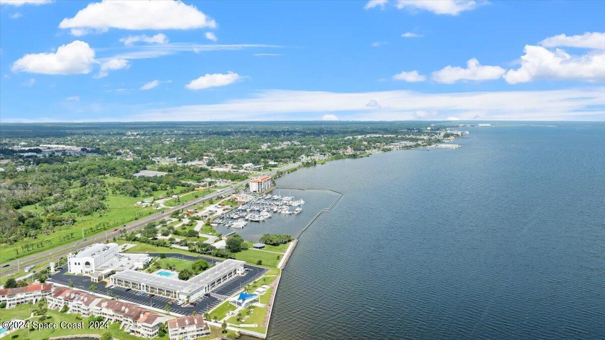 5087 Riveredge Drive, Unit 2 Titusville, FL 32780 - Photo 41 of 62 a view of a city with an ocean