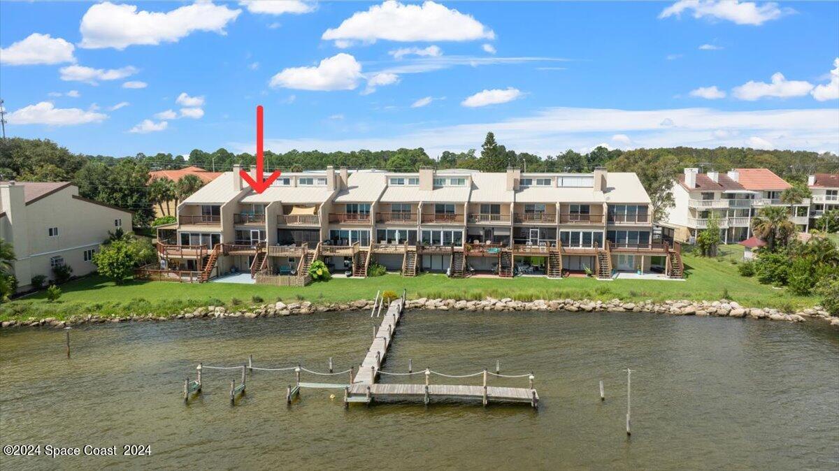 5087 Riveredge Drive, Unit 2 Titusville, FL 32780 - Photo 51 of 62 a view of a lake with a city