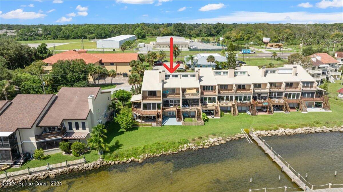 5087 Riveredge Drive, Unit 2 Titusville, FL 32780 - Photo 53 of 62 a view of multiple houses with a lake view