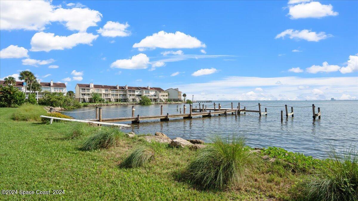 5087 Riveredge Drive, Unit 2 Titusville, FL 32780 - Photo 7 of 62 a view of a swimming pool and outdoor seating