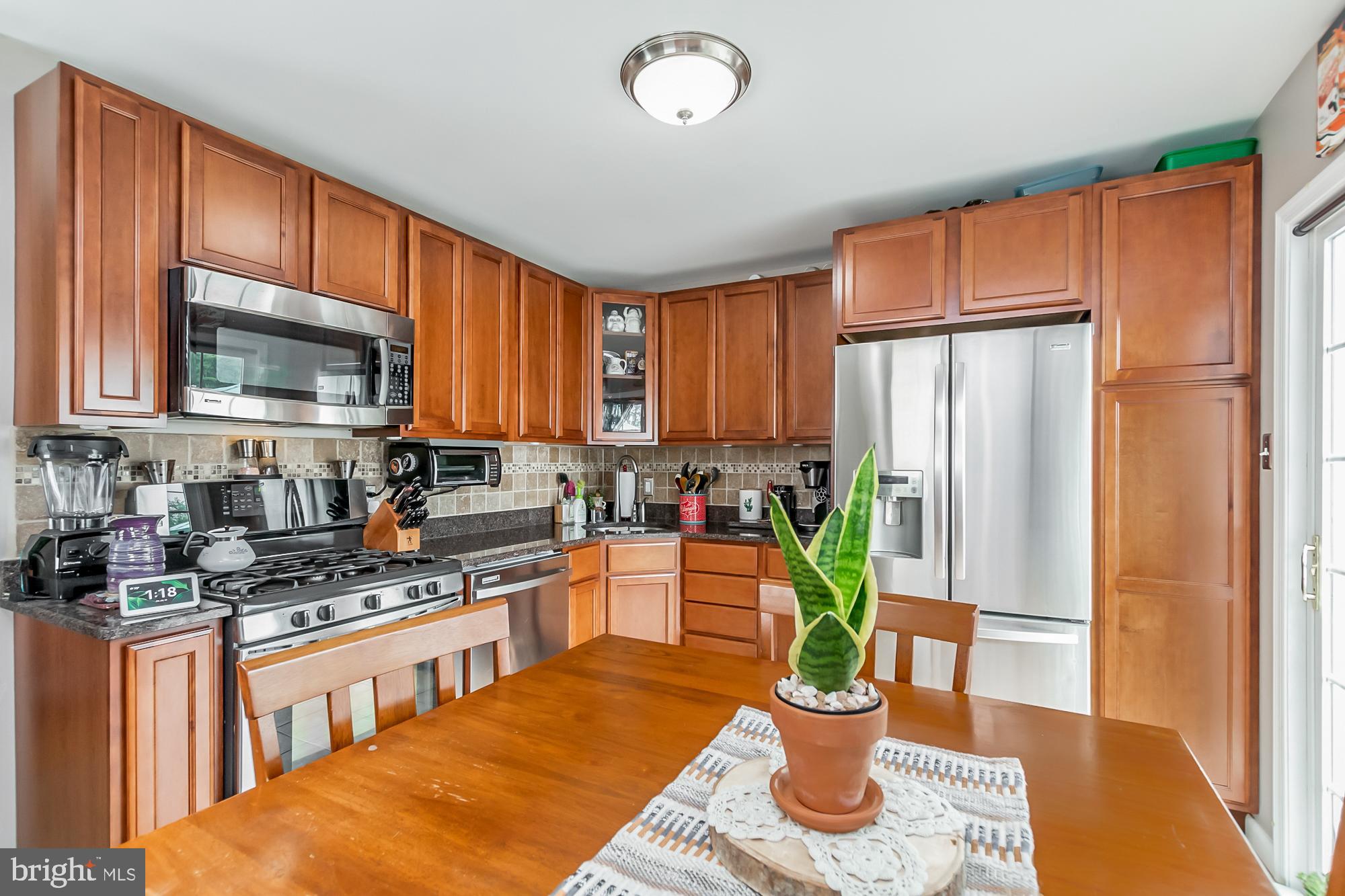 409 Brownell Road Baltimore, MD 21220 - Photo 17 of 41 42" cabinets & granite counter