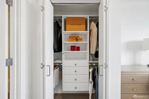 a bathroom with double sink and a mirror