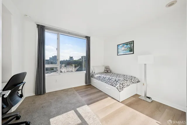 a bedroom with a large bed and a walk in closet