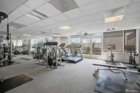 a outdoor patio with table and chairs