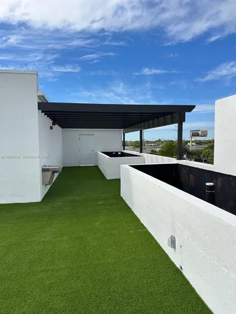 a backyard of a house with table and chairs