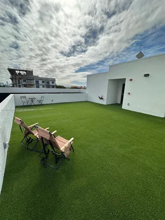 a view of a backyard with a small cabin