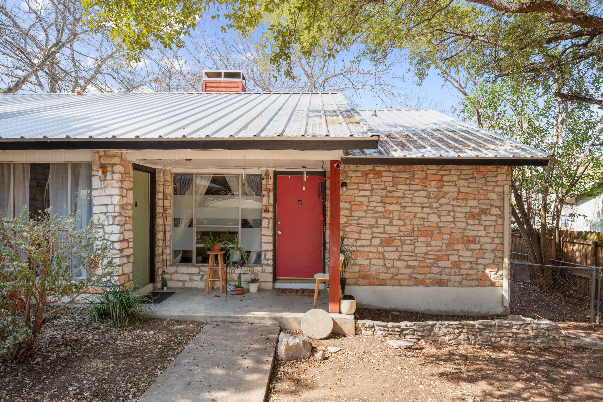 5402 Brompton Circle Austin, TX 78745 - Photo 6 of 30 The covered front porch creates a welcoming entry with added outdoor living space.