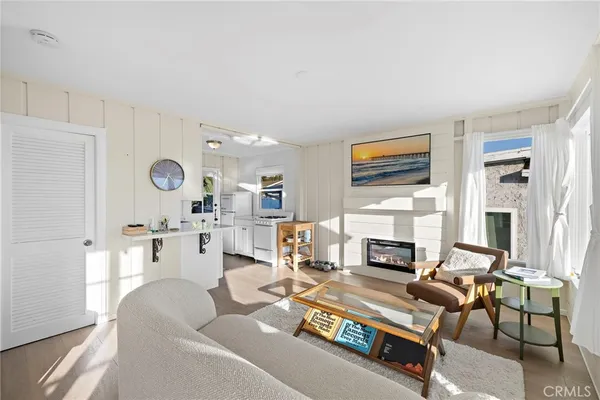 a living room with furniture fireplace and flat screen tv