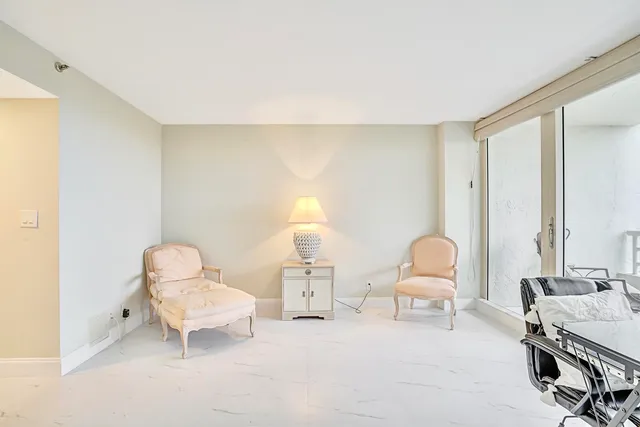 a living room with furniture and a chair