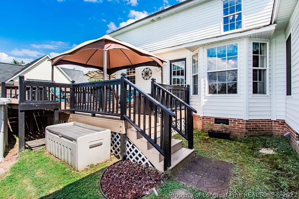 1105 John McMillan Road Hope Mills, NC 28348 - Photo 11 of 50 a view of a house with backyard and deck