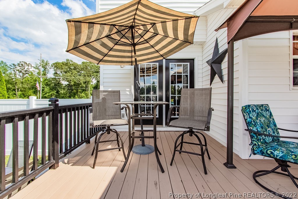 1105 John McMillan Road Hope Mills, NC 28348 - Photo 14 of 50 a view of a chairs and table in the balcony