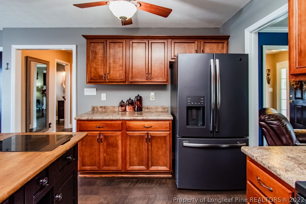 1105 John McMillan Road Hope Mills, NC 28348 - Photo 17 of 50 a kitchen with stainless steel appliances granite countertop a refrigerator and a sink