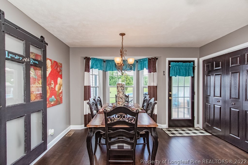 1105 John McMillan Road Hope Mills, NC 28348 - Photo 19 of 50 a view of a livingroom with furniture staircase and windows