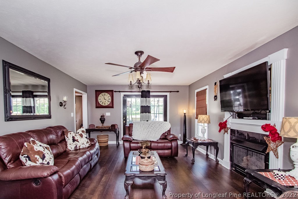 1105 John McMillan Road Hope Mills, NC 28348 - Photo 24 of 50 a living room with furniture and a flat screen tv