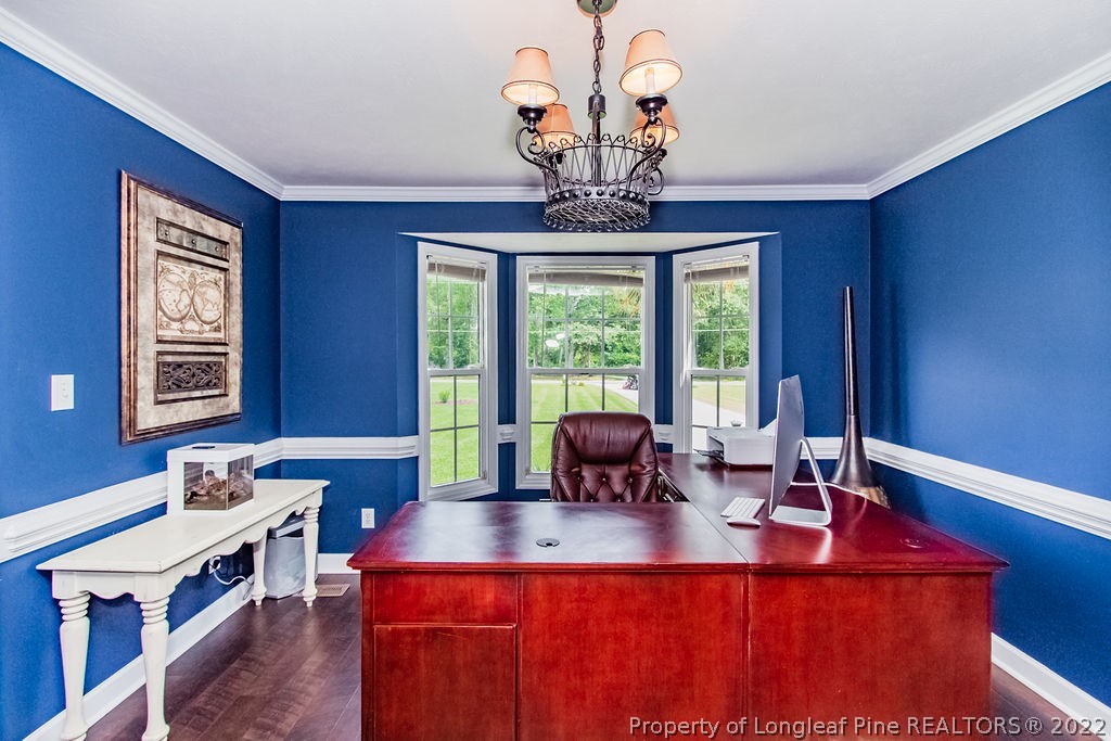 1105 John McMillan Road Hope Mills, NC 28348 - Photo 26 of 50 a view of a dining room with furniture a chandelier and windows