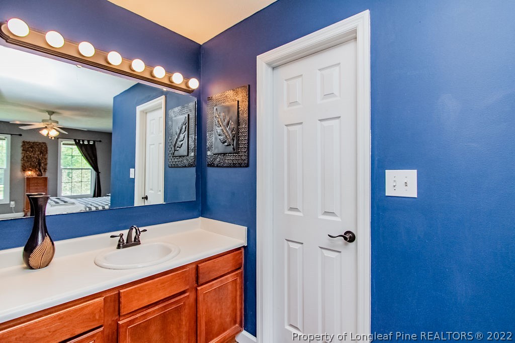 1105 John McMillan Road Hope Mills, NC 28348 - Photo 32 of 50 a bathroom with a sink and a mirror