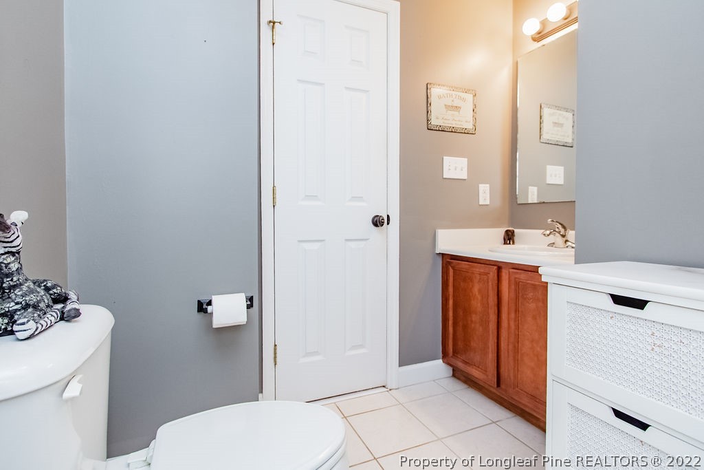 1105 John McMillan Road Hope Mills, NC 28348 - Photo 40 of 50 a bathroom with a sink a toilet and shower