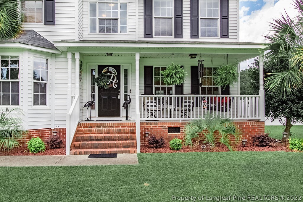 1105 John McMillan Road Hope Mills, NC 28348 - Photo 4 of 50 a front view of a house with garden