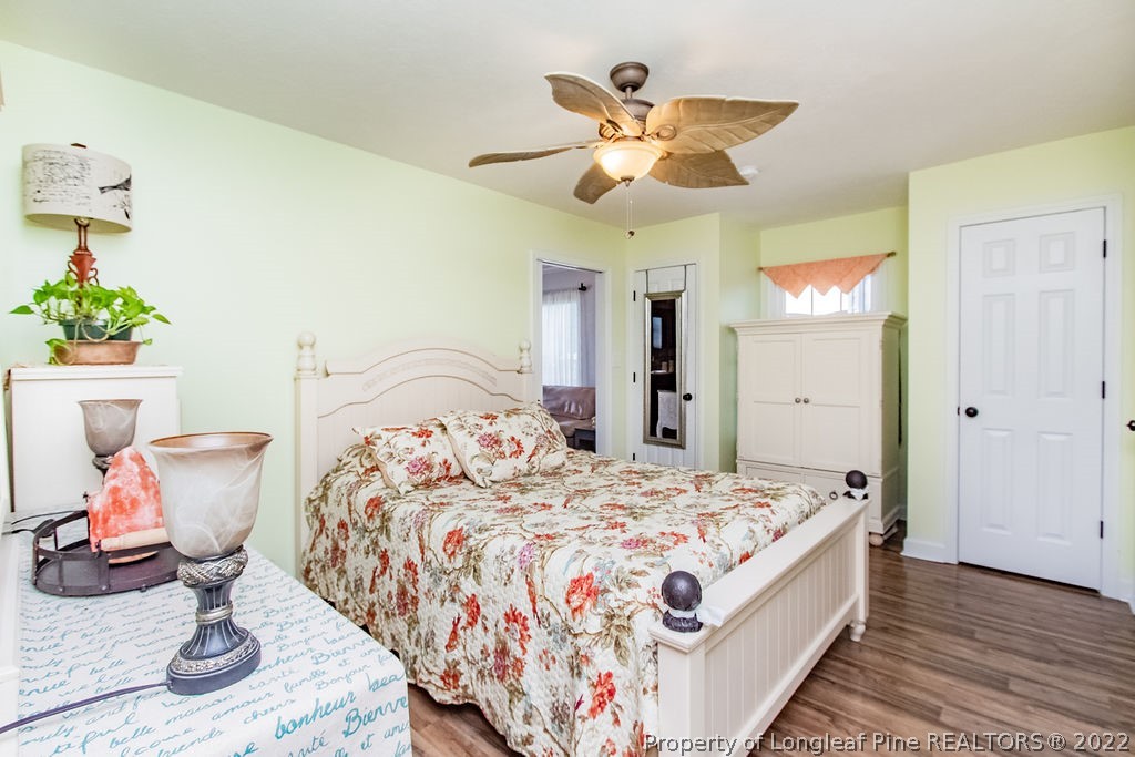 1105 John McMillan Road Hope Mills, NC 28348 - Photo 42 of 50 a bedroom with bed and wooden floor