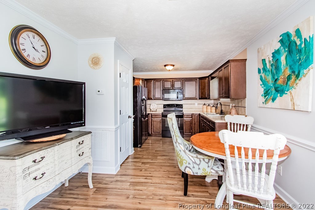 1105 John McMillan Road Hope Mills, NC 28348 - Photo 45 of 50 a living room with furniture and a flat screen tv