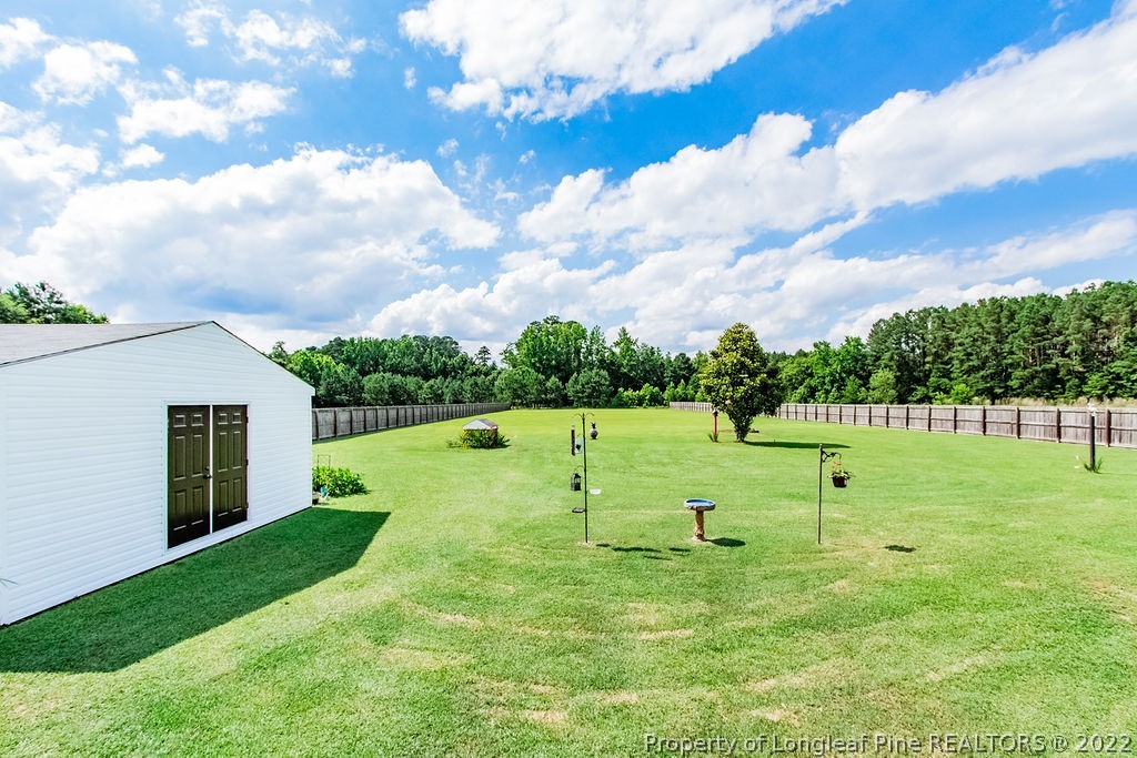 1105 John McMillan Road Hope Mills, NC 28348 - Photo 6 of 50 a view of outdoor space with deck and green space
