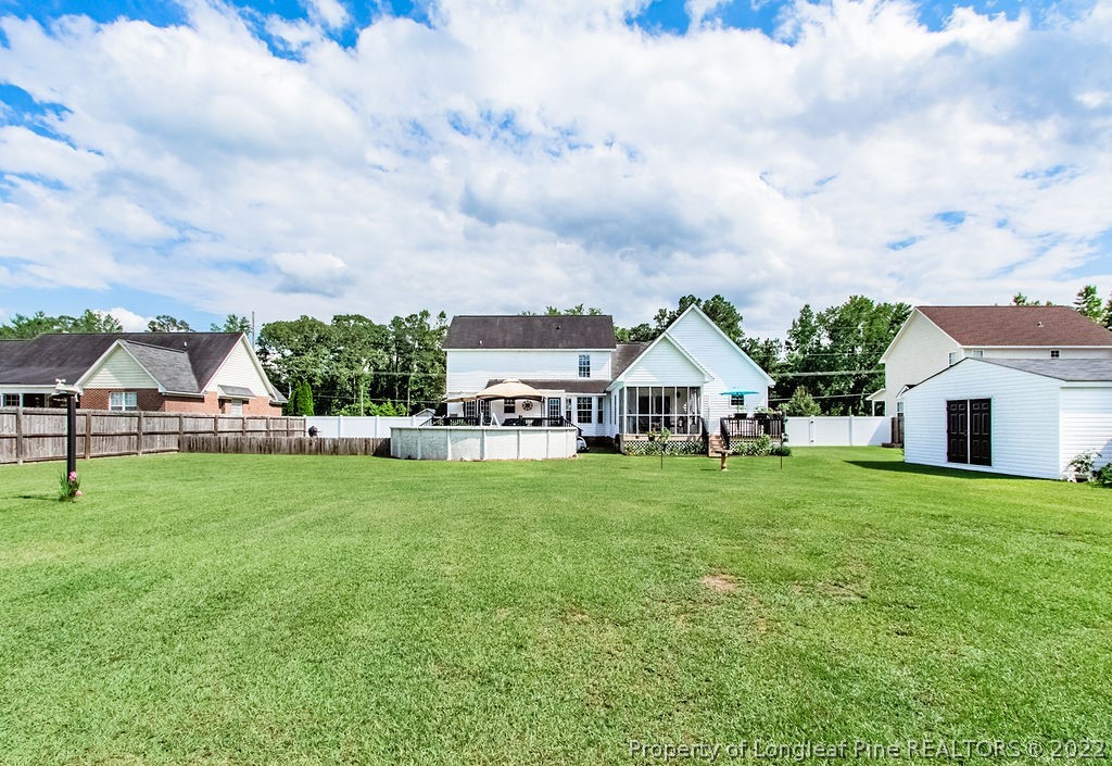 1105 John McMillan Road Hope Mills, NC 28348 - Photo 9 of 50 a house with garden in front of it