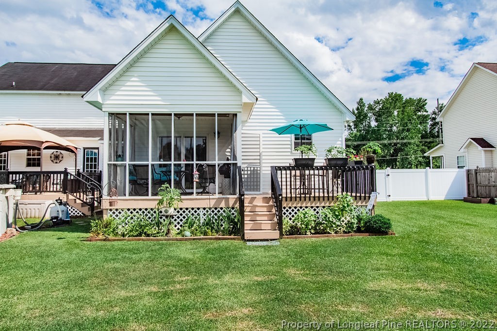 1105 John McMillan Road Hope Mills, NC 28348 - Photo 10 of 50 a front view of a house with a garden