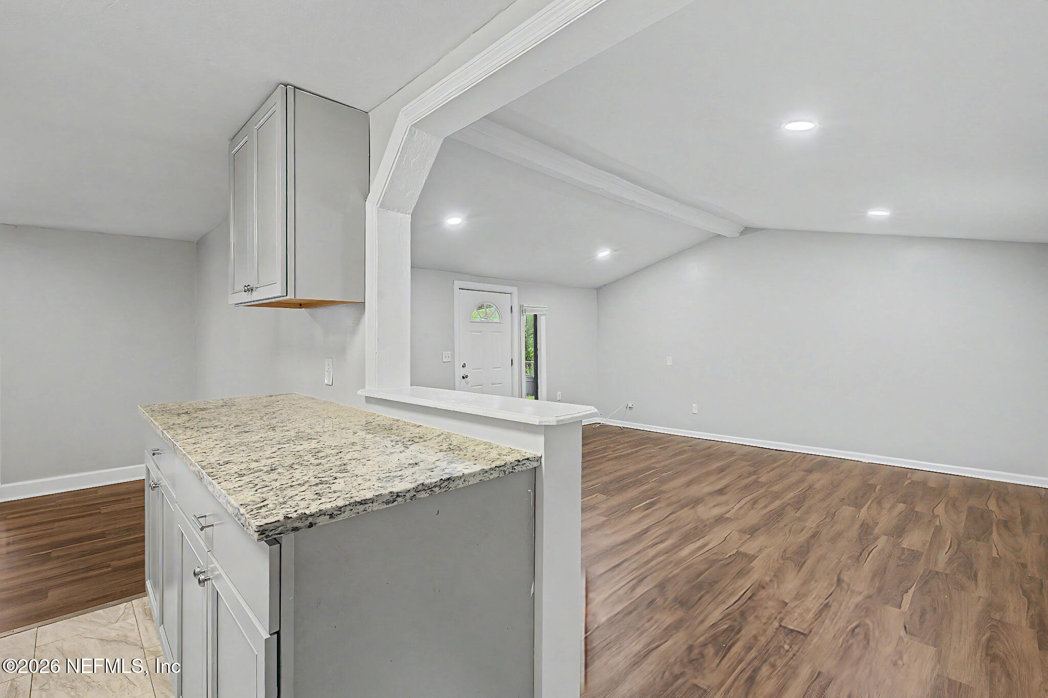 2625 Kohn Road Jacksonville, FL 32210 - Photo 29 of 34 a view of kitchen island a sink wooden floor and a cabinet