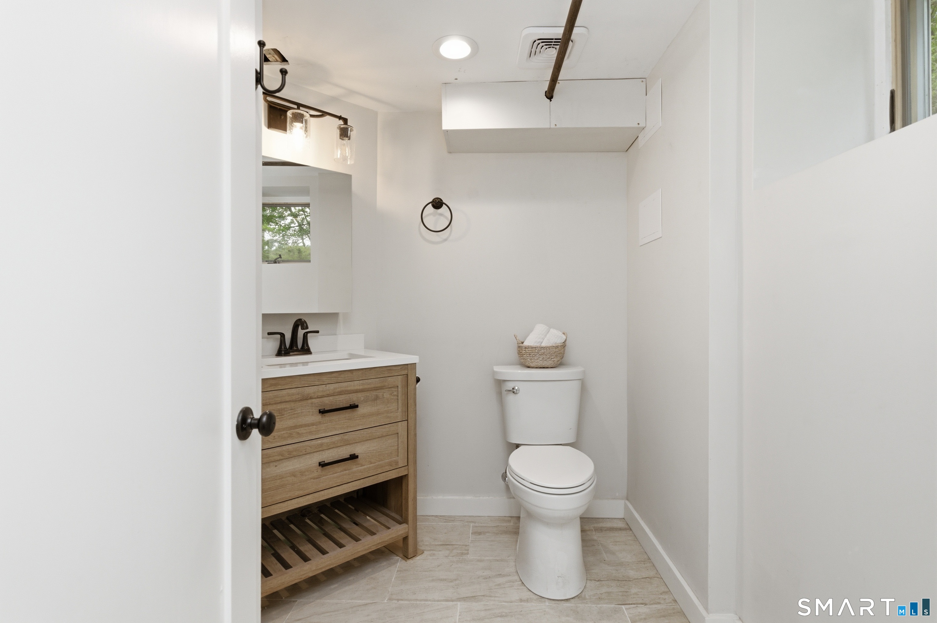 149 Mill Street Wethersfield, CT 06109 - Photo 21 of 29 a bathroom with a toilet sink and vanity