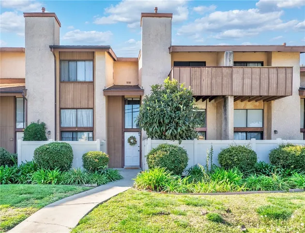 a house with a potted plant in front of it