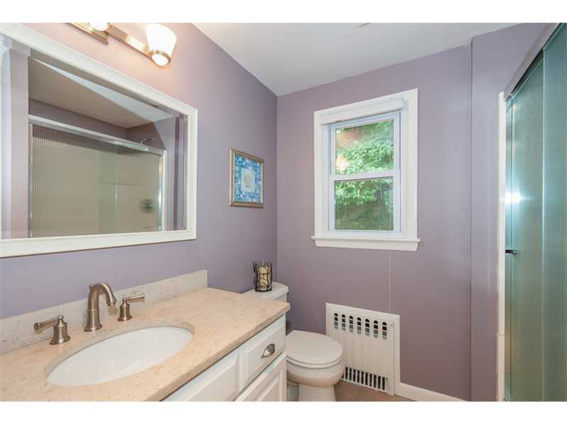 3 Green Lane Greenwich, CT 06831 - Photo 12 of 20 a bathroom with a toilet a sink a mirror and a window