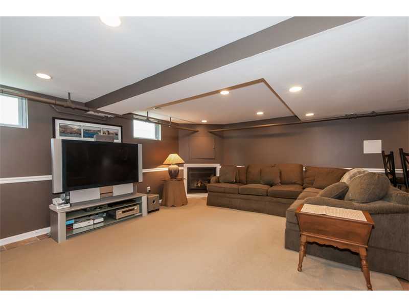3 Green Lane Greenwich, CT 06831 - Photo 13 of 20 a living room with furniture and a flat screen tv