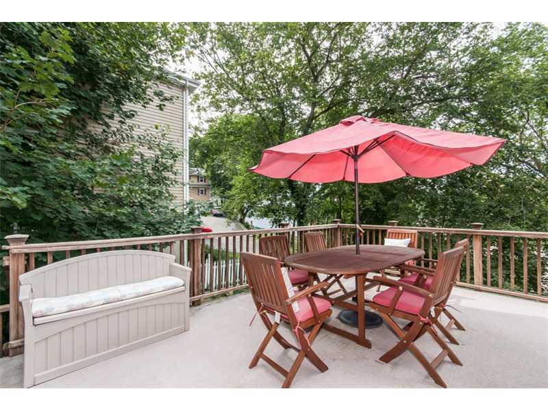 3 Green Lane Greenwich, CT 06831 - Photo 16 of 20 a patio with wooden floor a yard a table and chairs