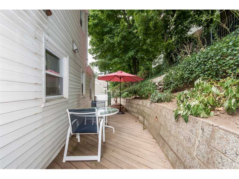 3 Green Lane Greenwich, CT 06831 - Photo 17 of 20 a backyard of a house with table and chairs