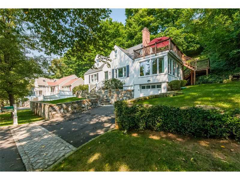 3 Green Lane Greenwich, CT 06831 - Photo 2 of 20 a front view of a house with a garden