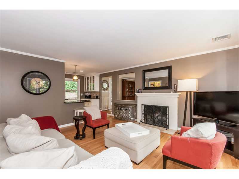 3 Green Lane Greenwich, CT 06831 - Photo 4 of 20 a living room with furniture a flat screen tv and a fireplace