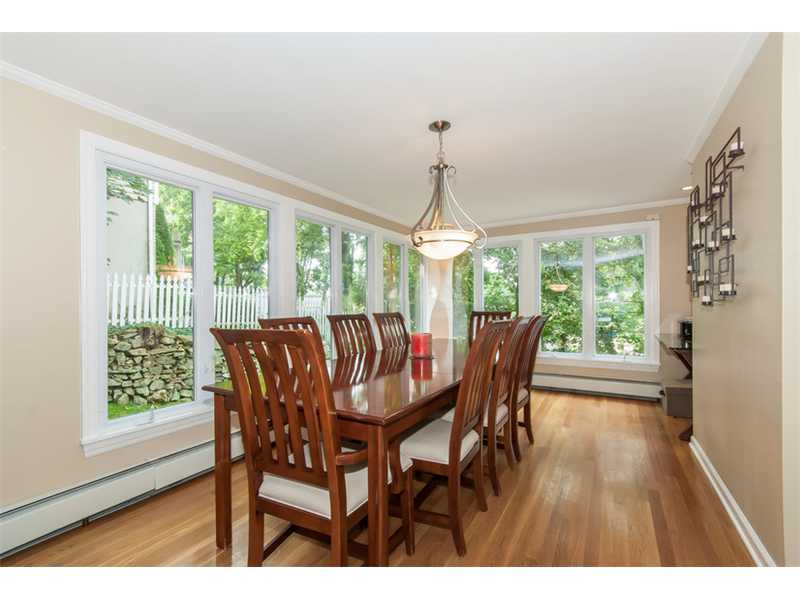 3 Green Lane Greenwich, CT 06831 - Photo 5 of 20 a view of a dining room with furniture large windows and wooden floor