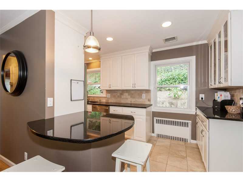 3 Green Lane Greenwich, CT 06831 - Photo 6 of 20 a kitchen with a stove a sink and a window