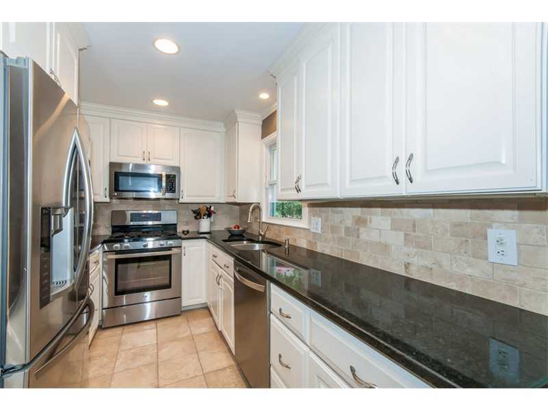3 Green Lane Greenwich, CT 06831 - Photo 7 of 20 a kitchen with stainless steel appliances granite countertop a stove a sink and a granite counter tops