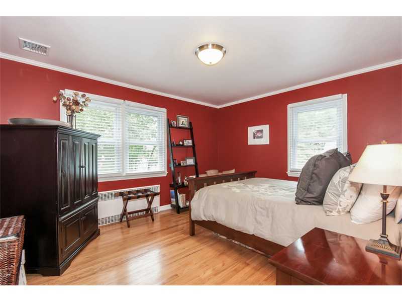 3 Green Lane Greenwich, CT 06831 - Photo 8 of 20 a bedroom with a bed and a large window