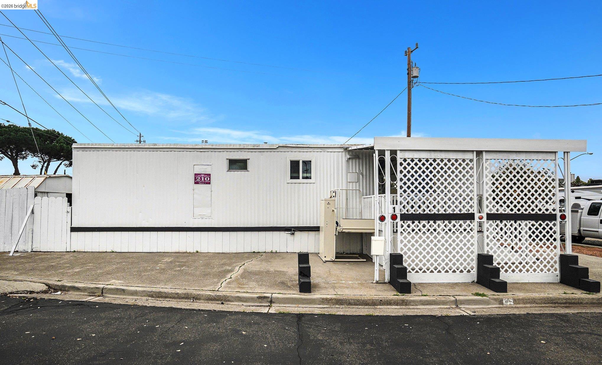 210 West Cypress Road, Unit 1 Oakley, CA 94561 - Photo 3 of 26 a view of a street with brick wall