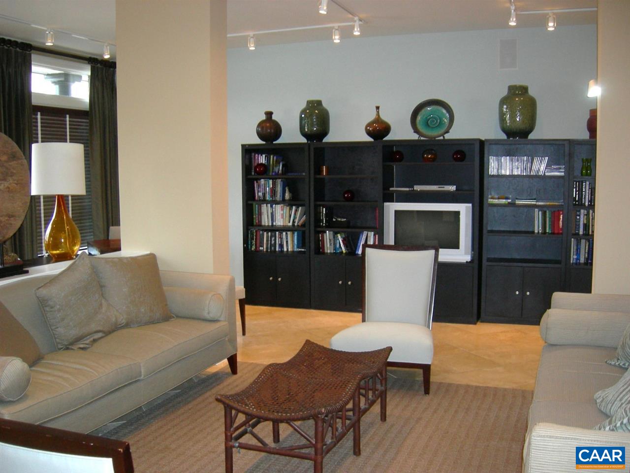 775 Walker Square, Unit 3C Charlottesville, VA 22903 - Photo 12 of 17 a living room with furniture and lamp