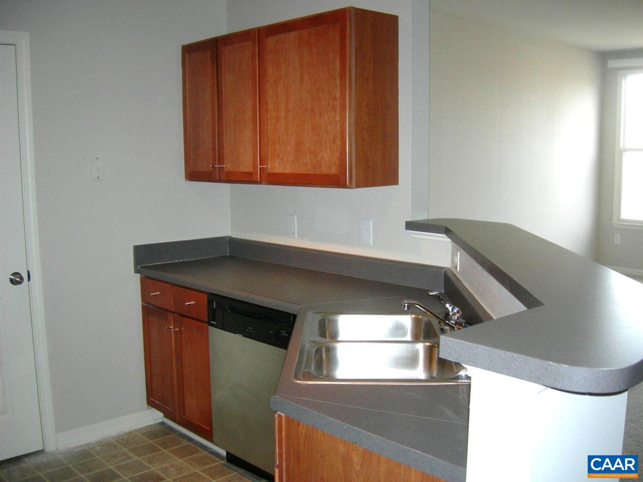 775 Walker Square, Unit 3C Charlottesville, VA 22903 - Photo 2 of 17 a kitchen with a sink and cabinets